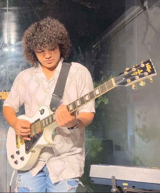 Logus Sethia, founder of Ashlar Audio, playing electric guitar